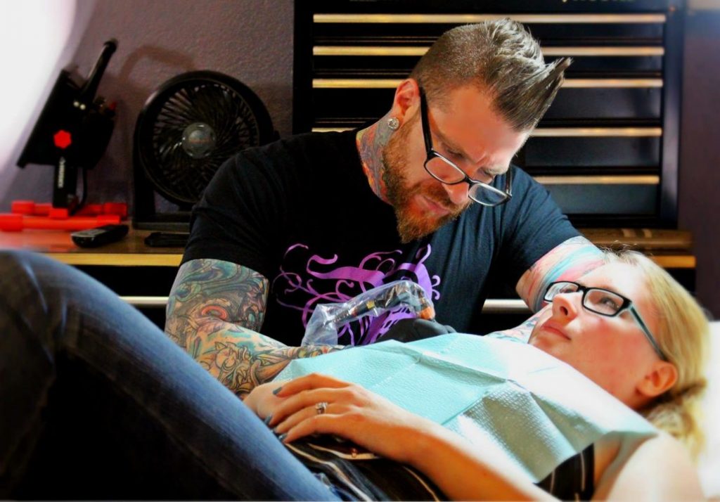 All You Need To Know About Black Light Tattoos, According to Tattoo Artists