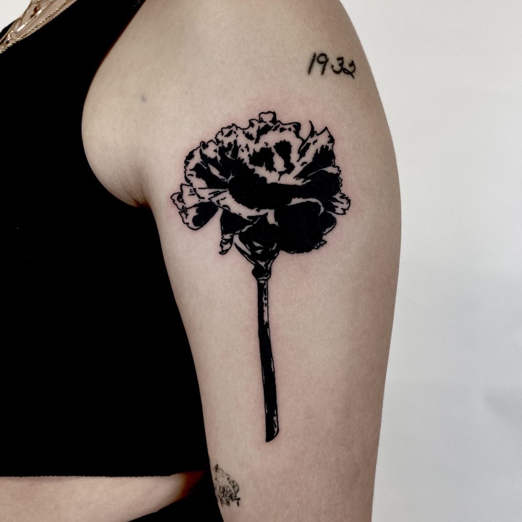Black flower tattoo