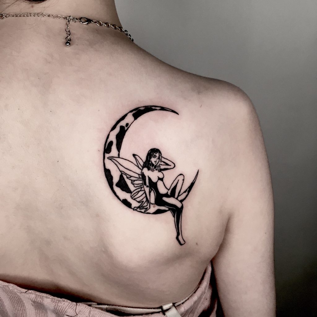 Black fairy on a moon tattoo