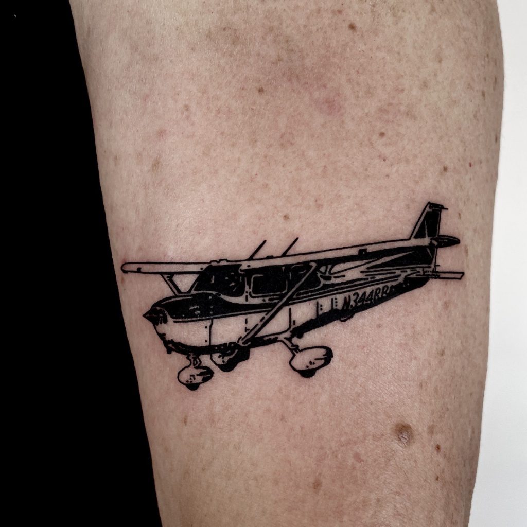 Black plane tattoo