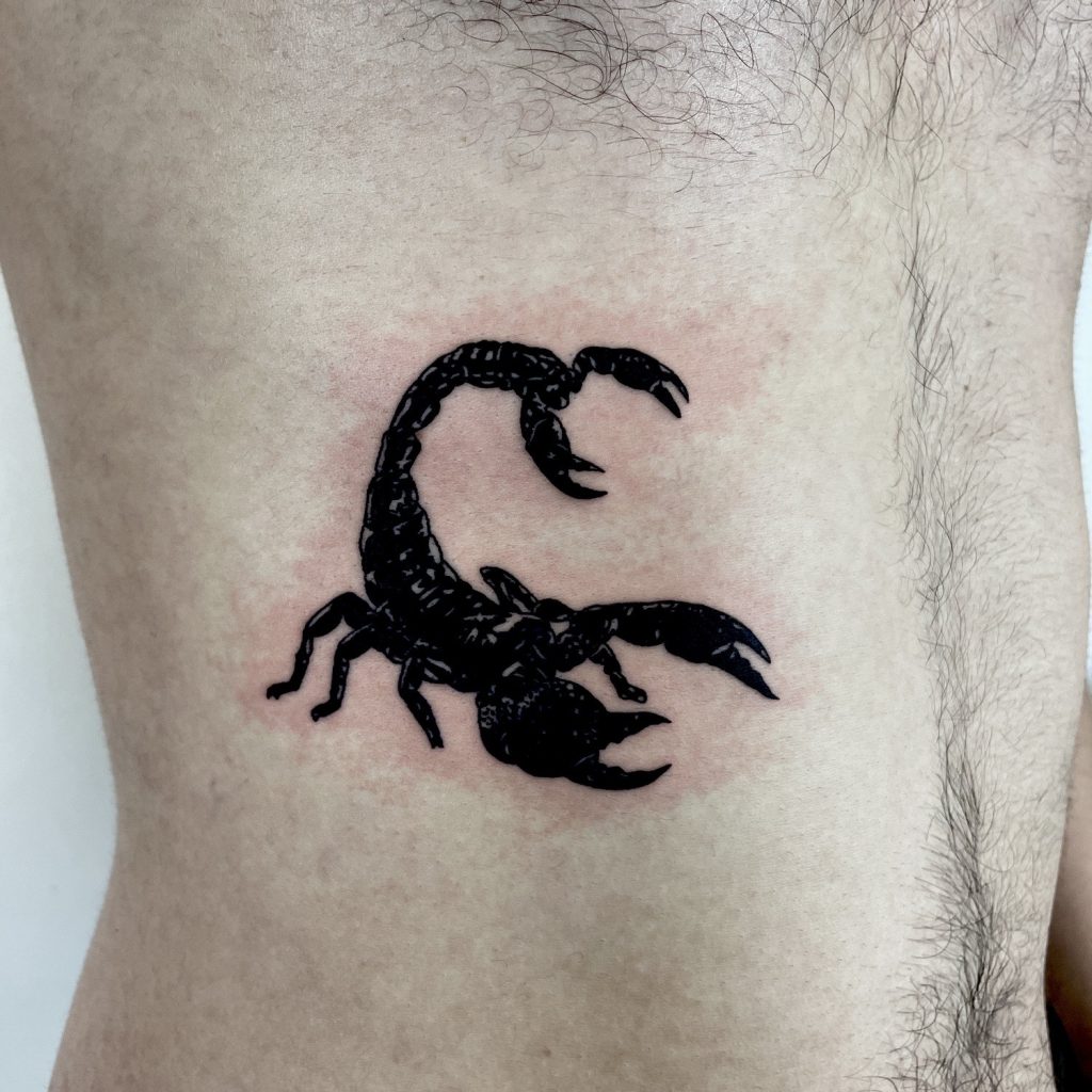 Black scorpion tattoo
