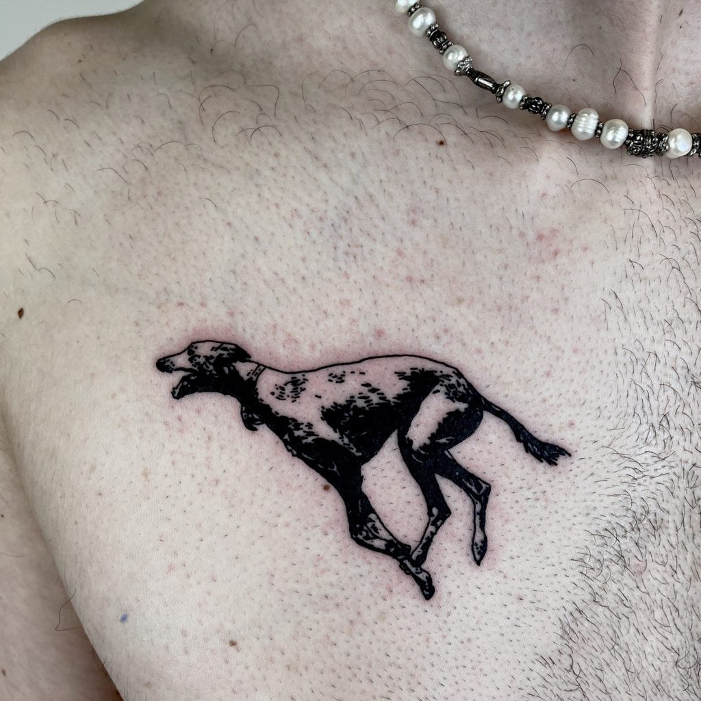 Black greyhound tattoo