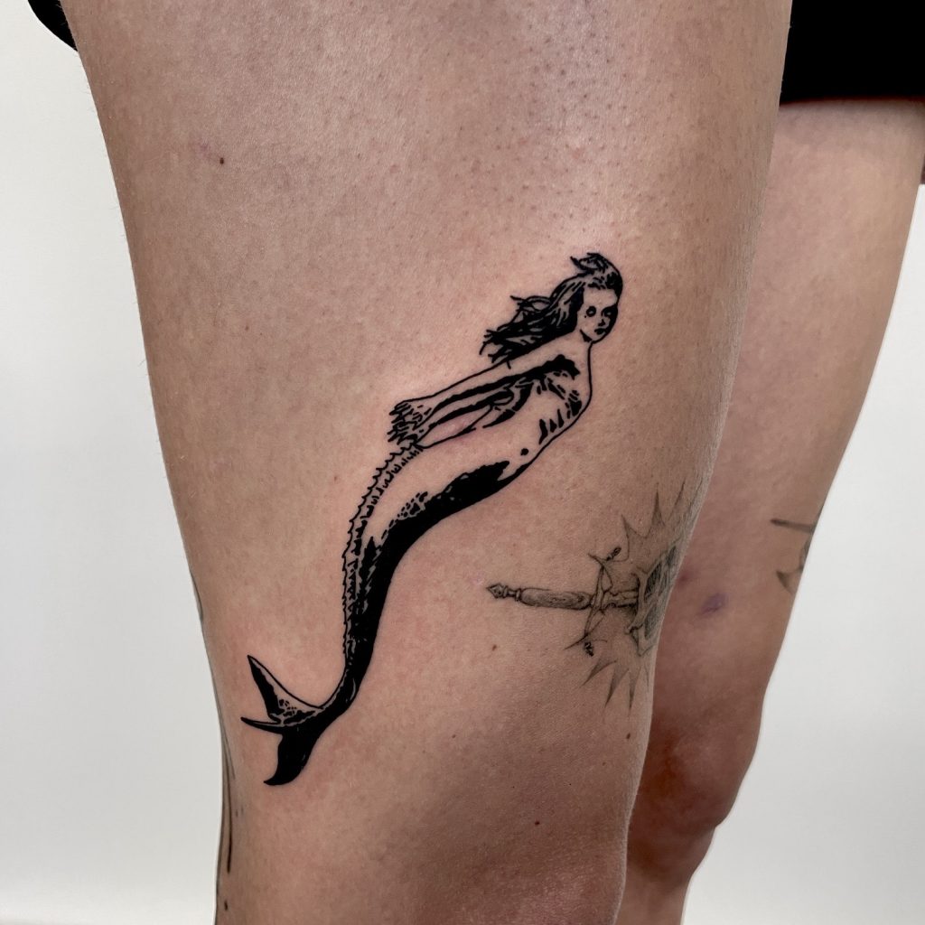 Black mermaid tattoo