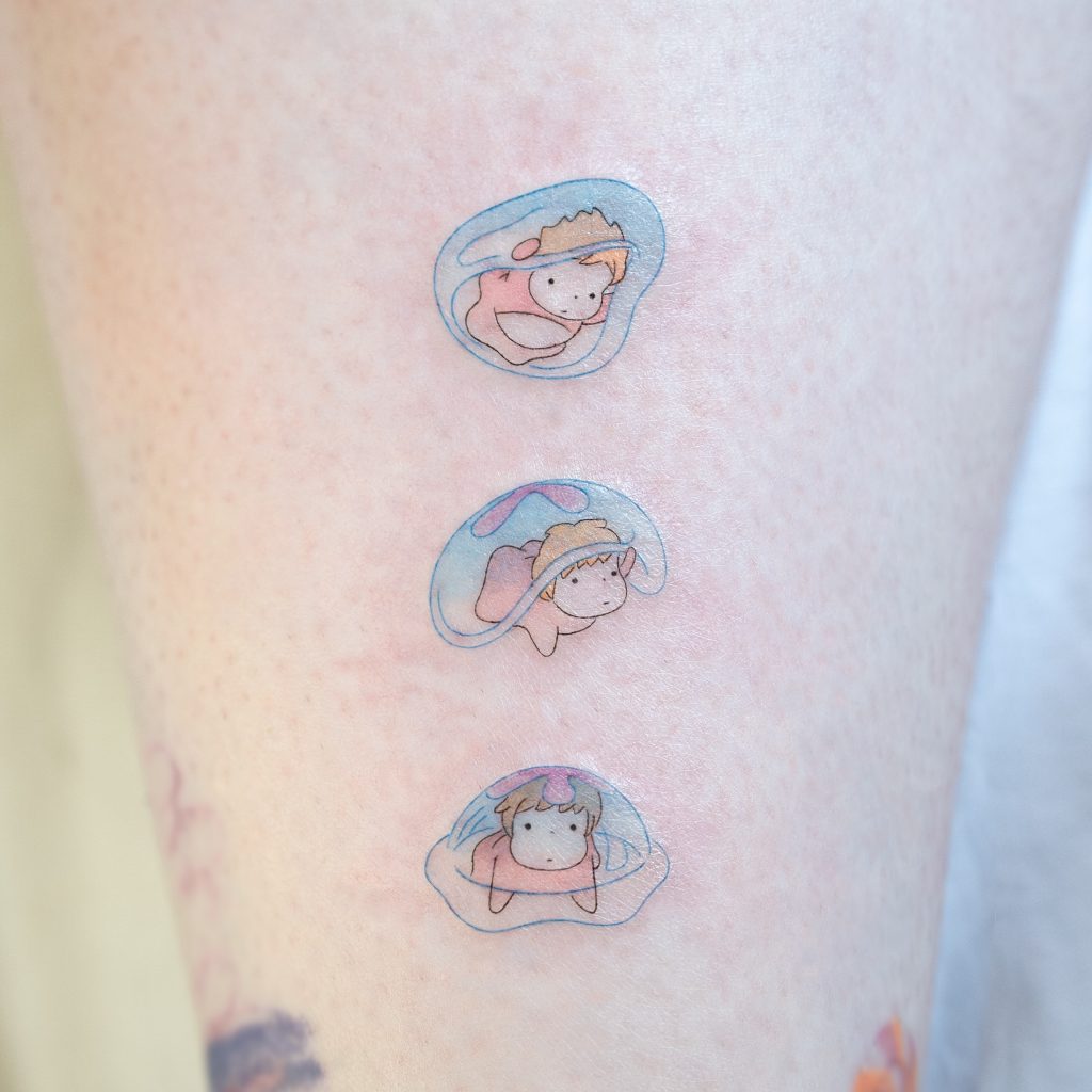 Tiny bubble character tattoo
