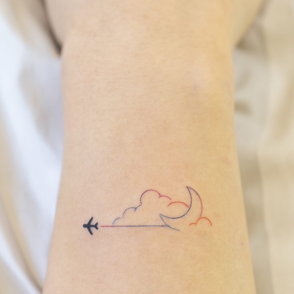 Plane and cloud tattoo