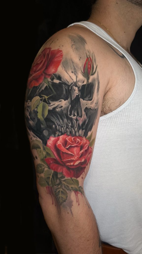 Large skull old script cover-up tattoo