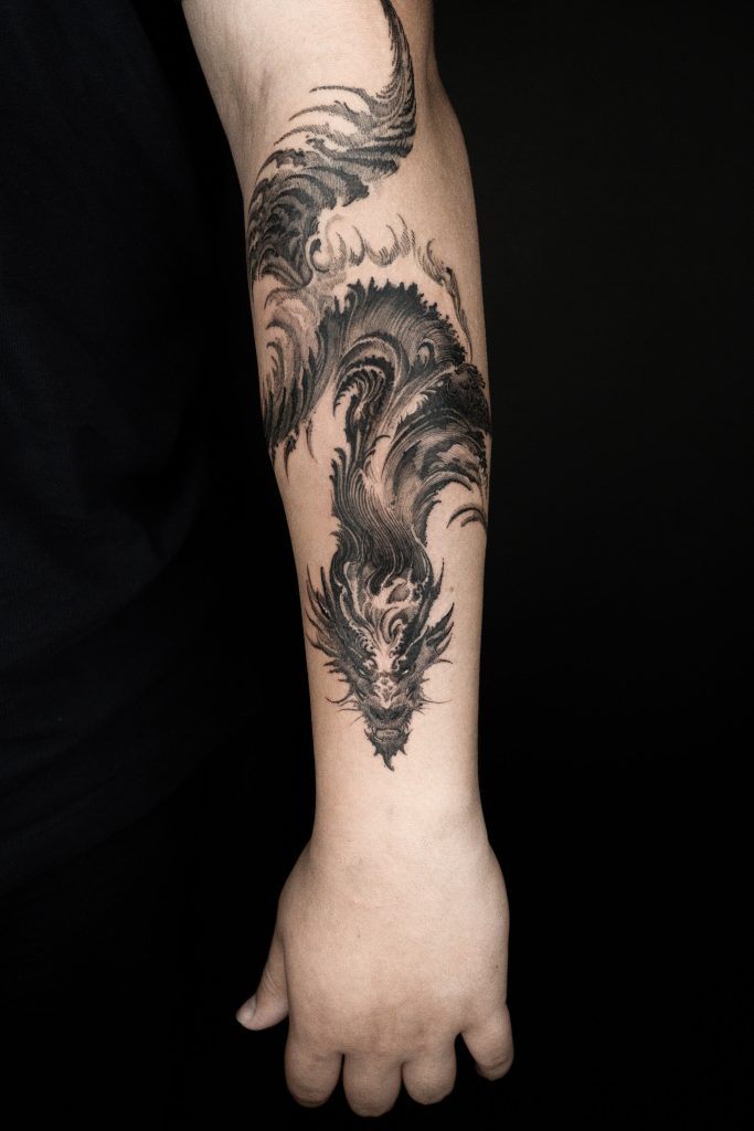 Abstract blackwork dragon tattoo on arm by Sol